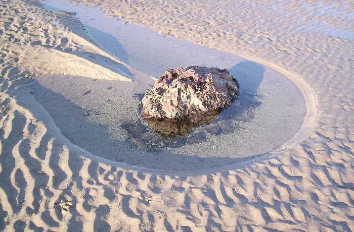 The sides of the rock are scoured clean.